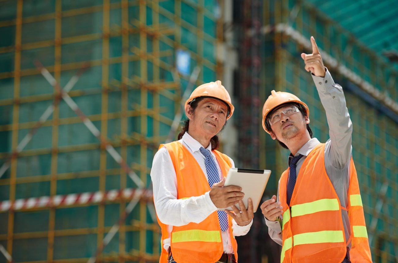 Vietnamese engineers discussing building of new skyscraper